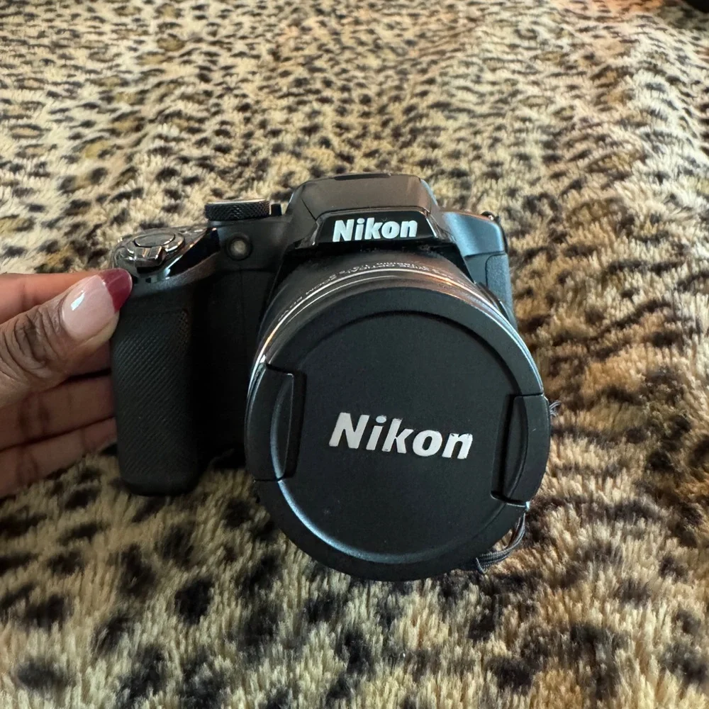 Nikon Black Camera with White Accessories
